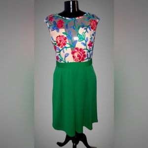 Floral embroidered green dress with sheer top.